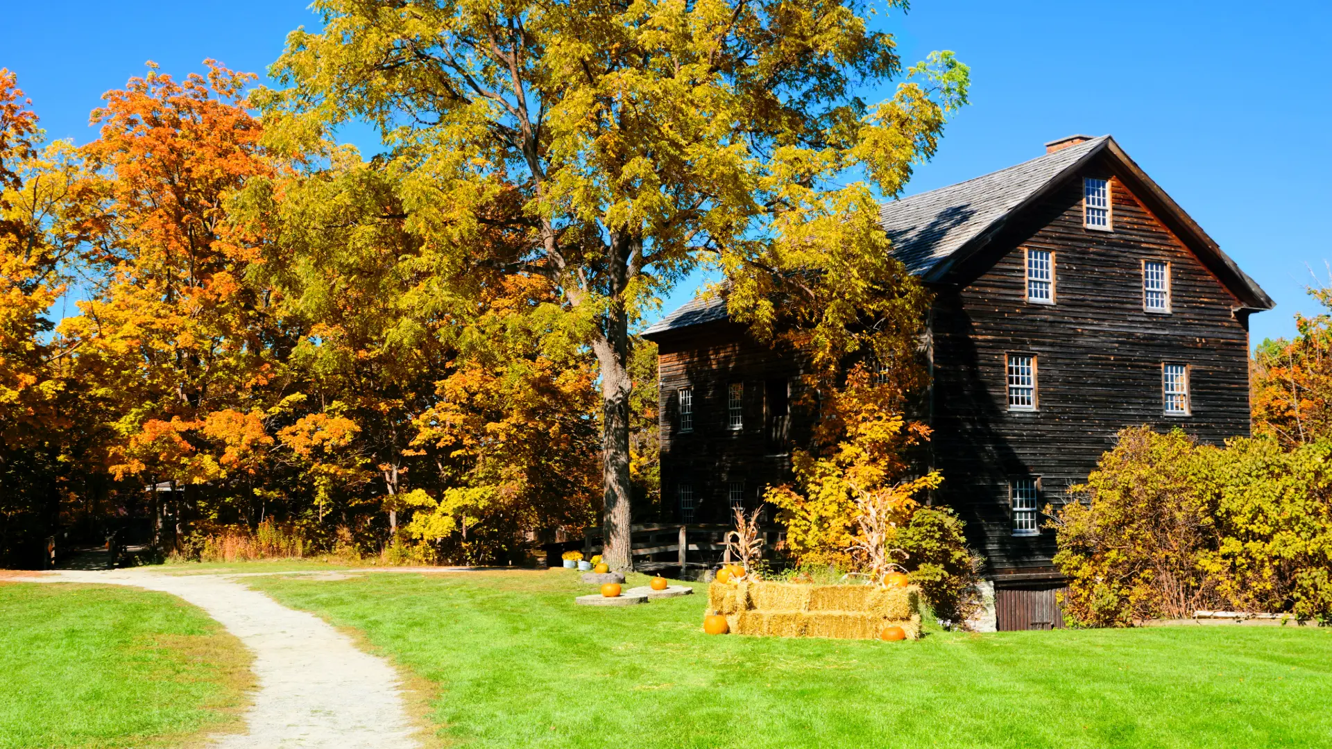 Historic timber mill surrounded by autumn colour in Eastern Ontario